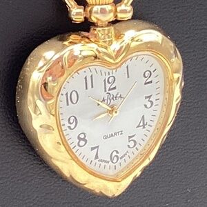 Labrea quartz pendent watch,   Gold in color.
